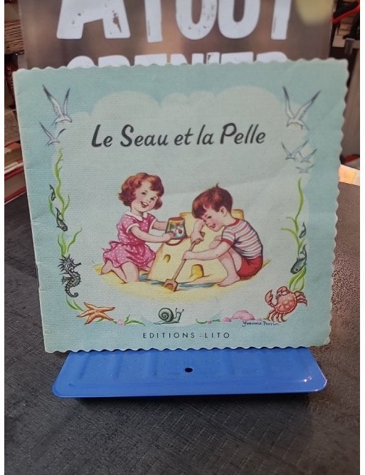 Le Seau Et La Pelle. - Livre pour enfants illustré par COLLECTIF